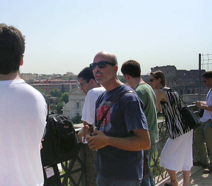 Mr. Castelli talking to a group of students during a tour of Rome